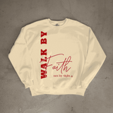 Beige sweatshirt with red text 'WALK BY Faith not by sight' on a gray background