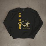 Black sweatshirt with yellow text 'Walk by Faith not by Sight' on a gray surface